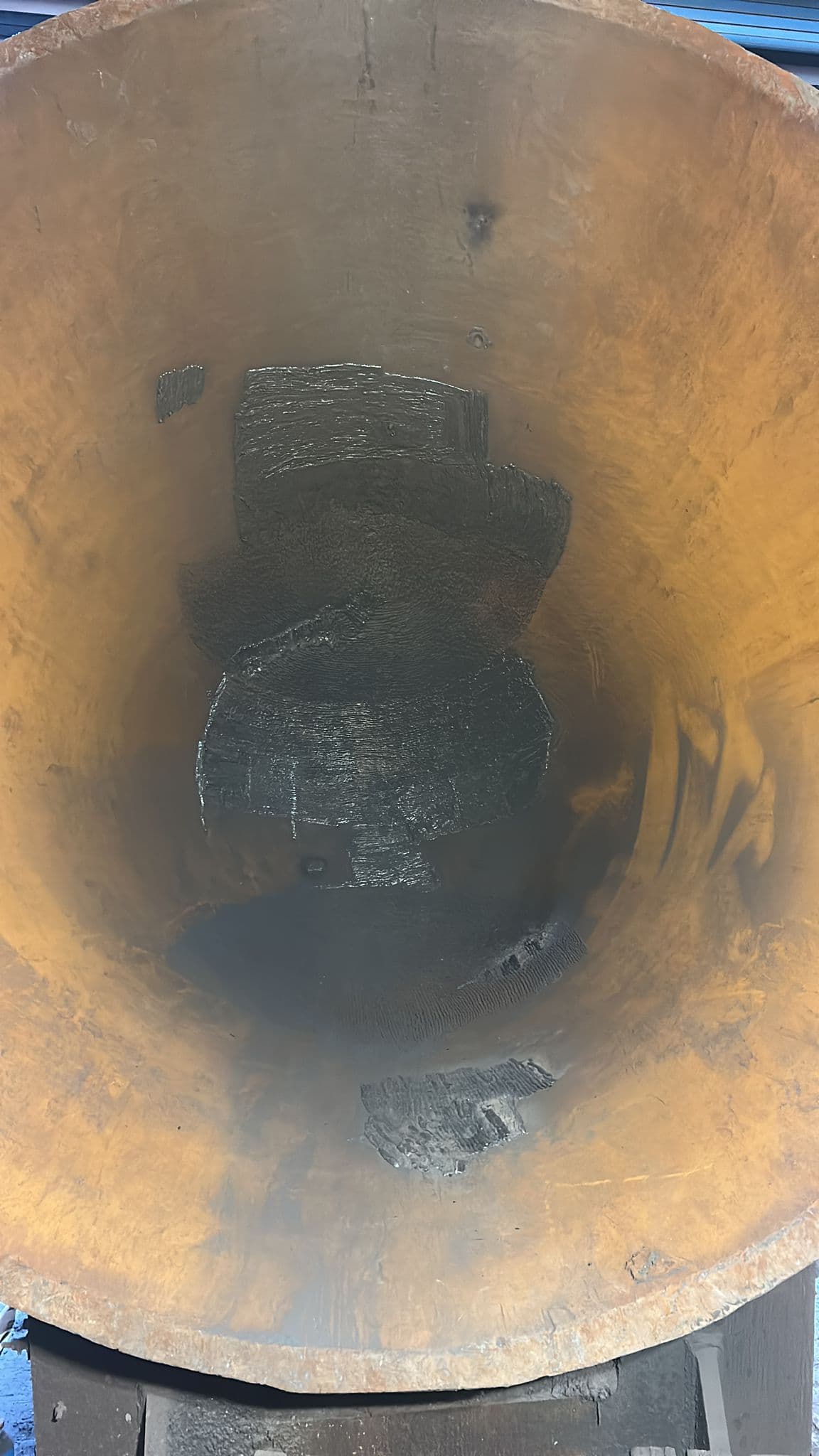 Slag pot interior showing completed weld repair sections